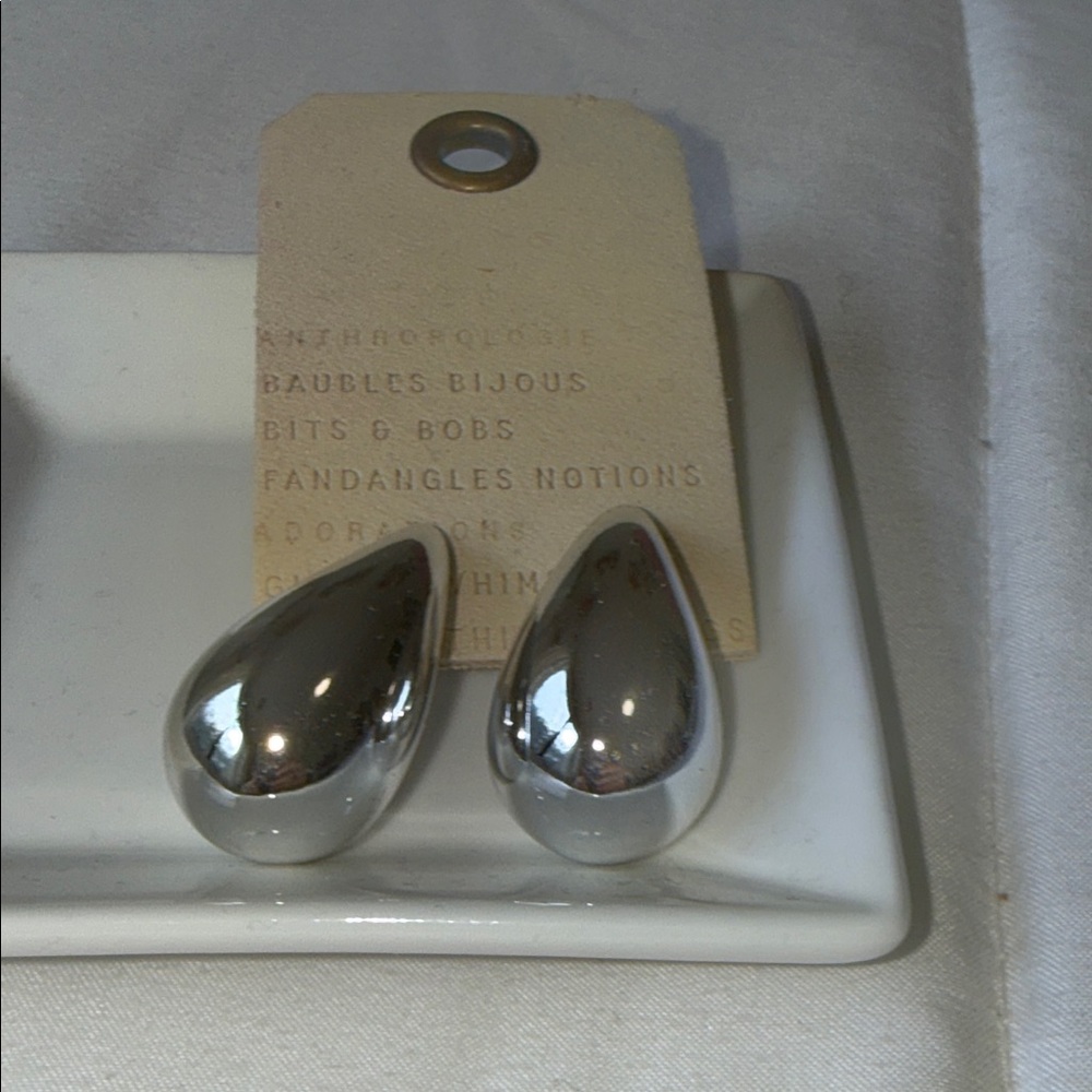 Anthropologie Silver tone  Teardrop Earrings. 
Minimalist statement piece